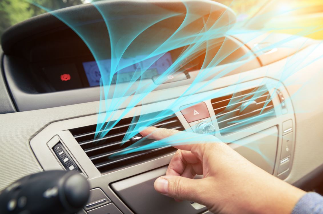 Auto Leaders mechanic checking car air conditioning